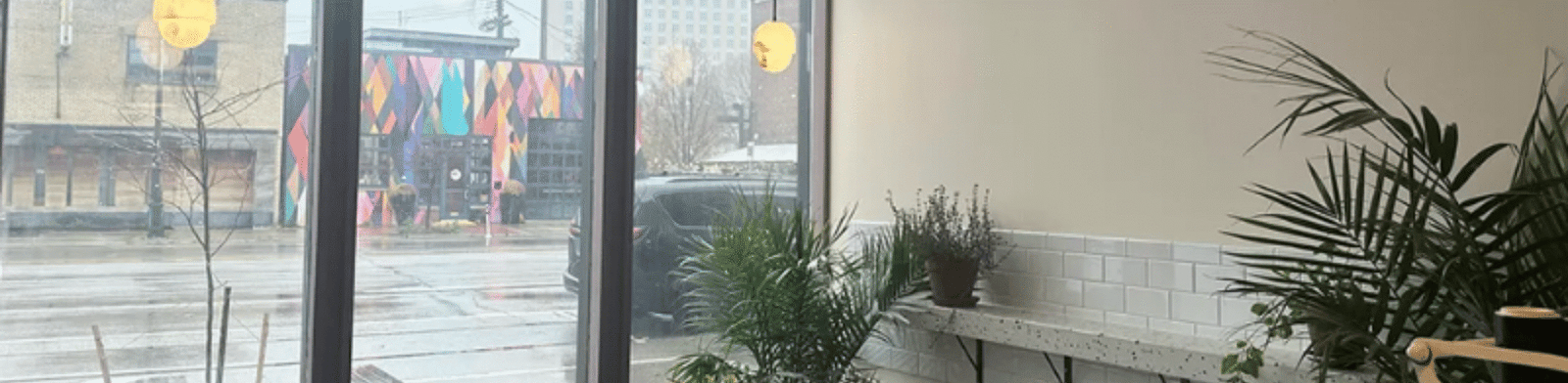 Interior of Alba Coffee Detroit with wood accents, espresso drinks, and minimalist seating