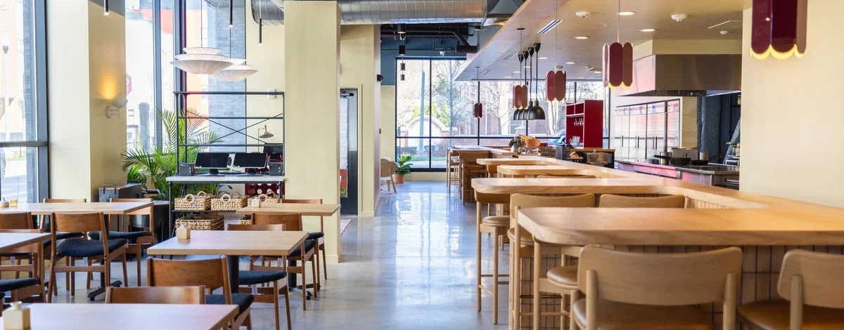 Interior of Leña Detroit restaurant with wood-fired kitchen and modern Latin decor