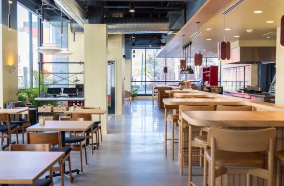 Interior of Leña Detroit restaurant with wood-fired kitchen and modern Latin decor