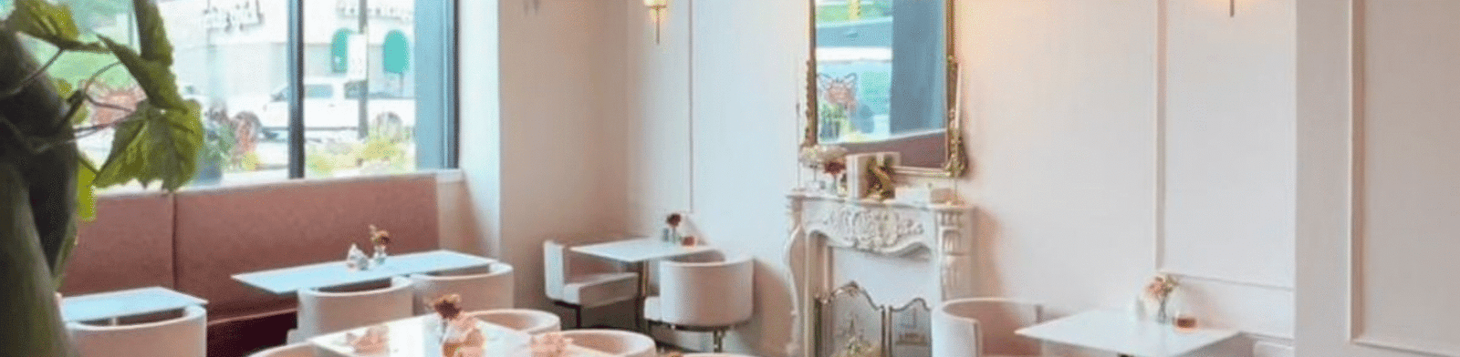 Interior of Lily’s & Elise Tea House Detroit with pastel tea setup and vintage floral china